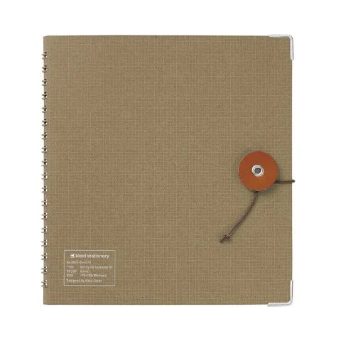 Kleid String Tie Notebook (grid)